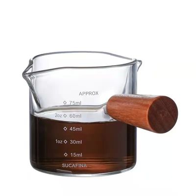 Coupe de mesure en verre borosilicate transparent de 100 ml avec un design minimaliste