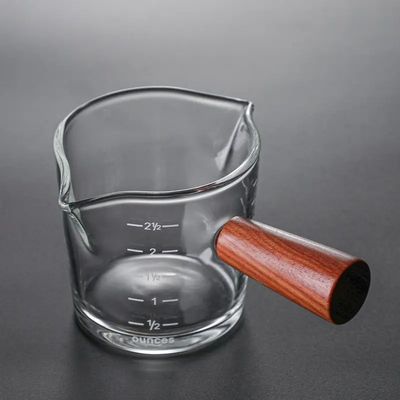 Coupe de mesure en verre borosilicate transparent de 100 ml avec un design minimaliste