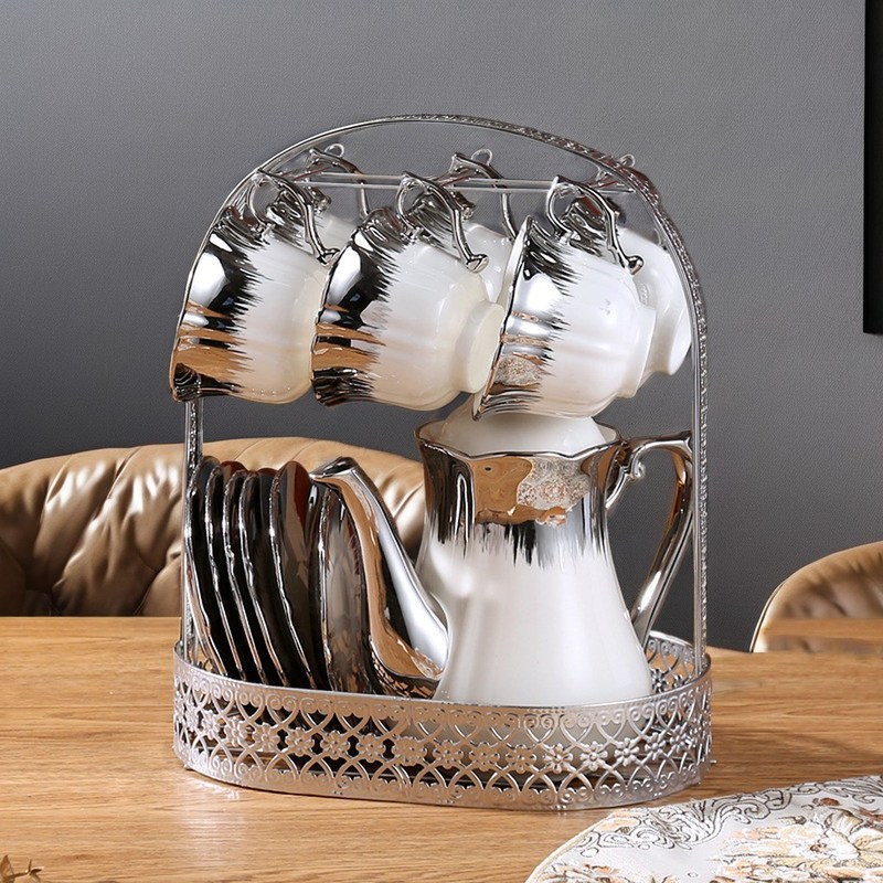 Un ensemble de thé en céramique d'une capacité de 1L avec un cercle d'or et un équipement de café de style Europe Design